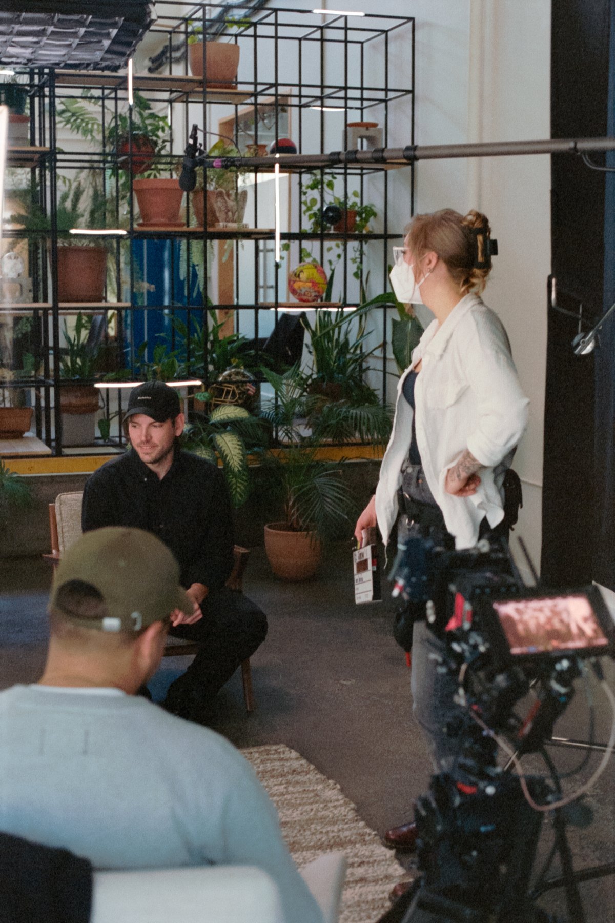 Behind the scenes on the Kamp Grizzly shoot: an interview setup with camera, boom, and crew.